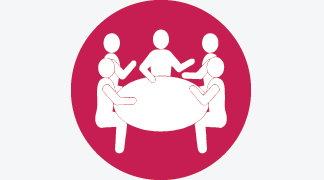 Icon of people talking around a table