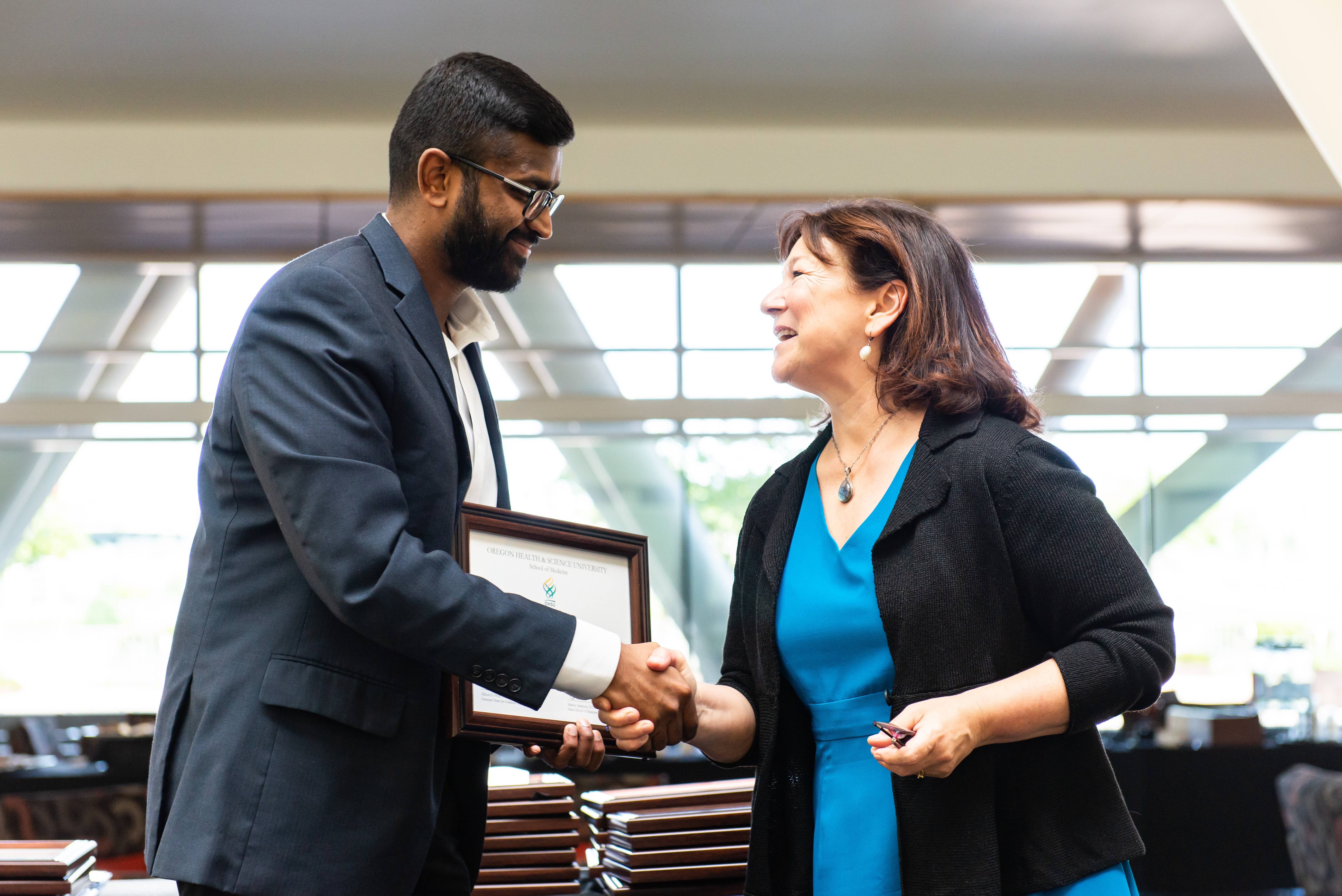SOM Honors and Awards 2019 - Raja Cholan of Department of Medical Informatics and Clinical Epidemiology (DMICE) with Dr. Allison Fryer