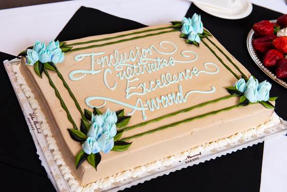 Sheet cake with Inclusion Cultivates Excellence Award written on it