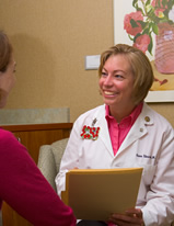Dr. Renee Edwards consults with a patient in her office.