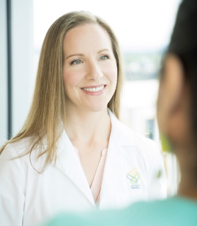 Antonia Gragg, a physician assistant, talks with a patient. She is part of our neurosurgery team.