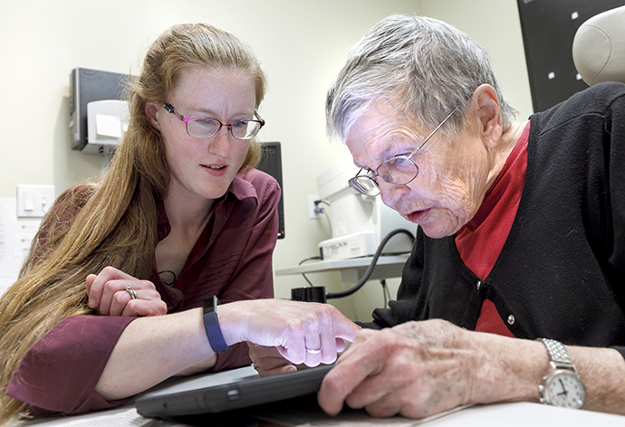 Kathryn Marxen-Simonson helps a patient learn to navigate with visual aids.