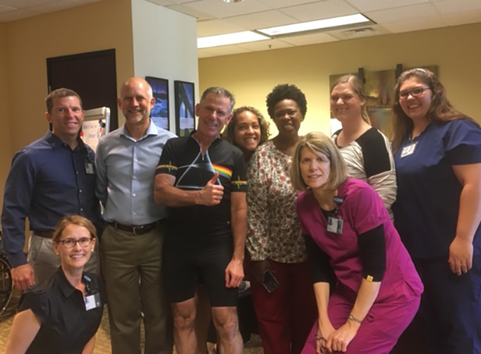 Dr. Wilson visits with doctors and staff from the Casey Eye Institute clinic in Vancouver, Washington