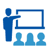 Graphic icon of a teacher in front of a white board addressing students.