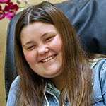 NICH patient Taylor Jennison smiling while getting a pedicure.