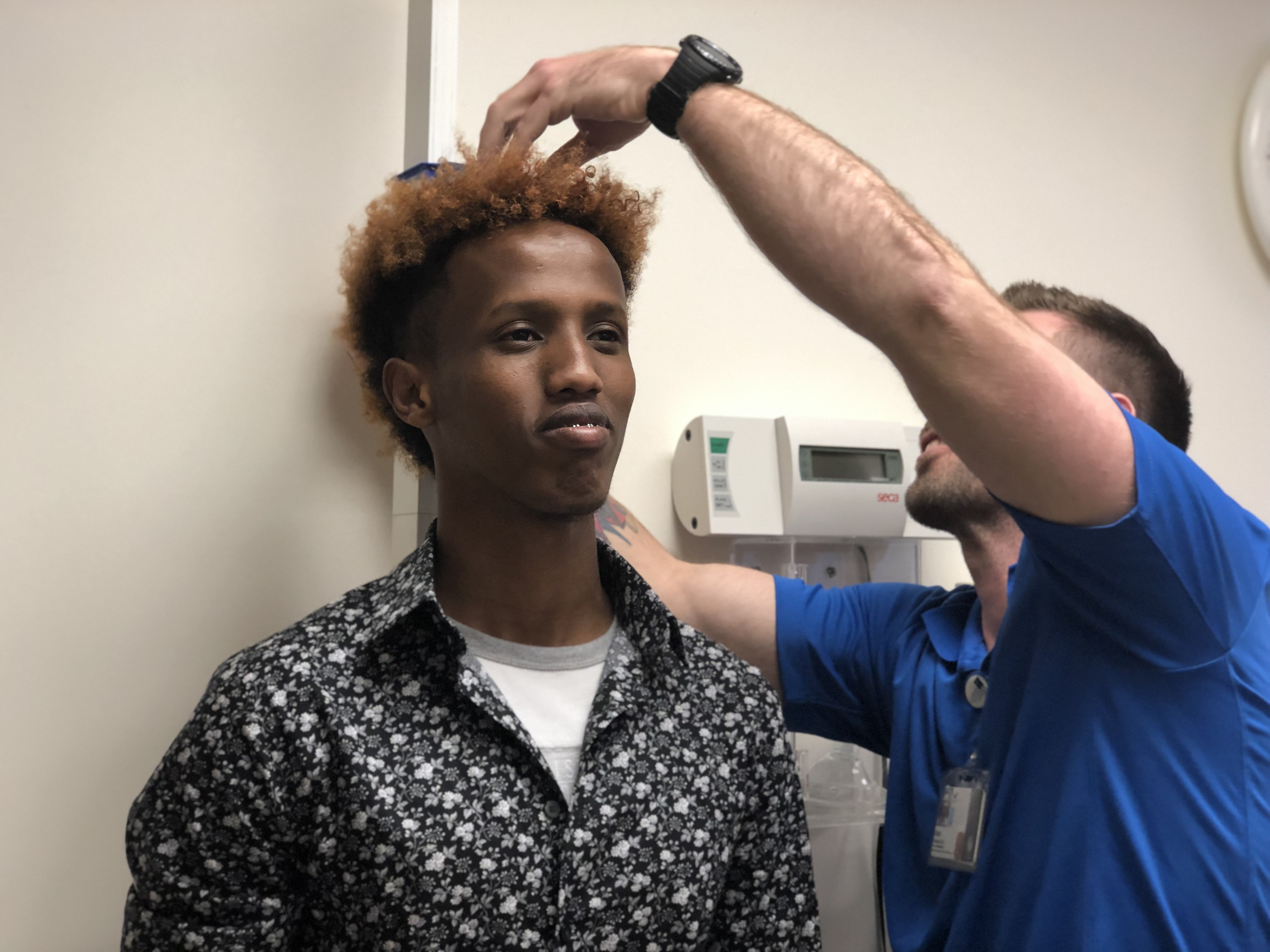 A member of the American-Somali soccer team gets measured in the Human Performance Lab