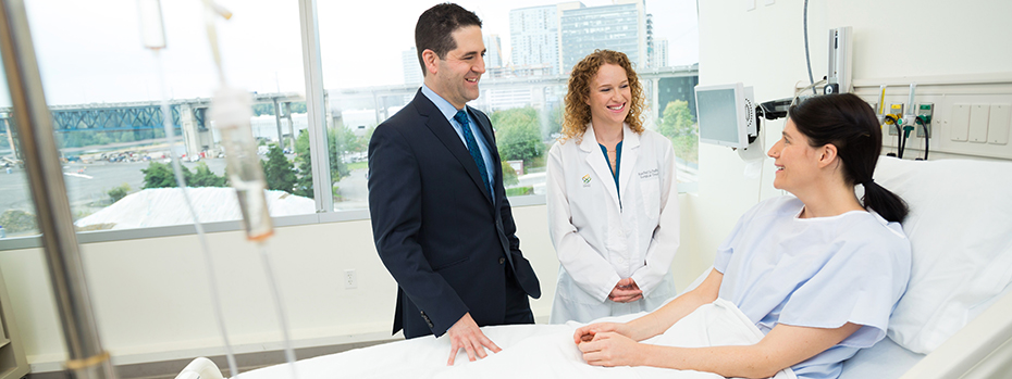 Dr. Mayo and nurse Rachel Schafer consult with a patient