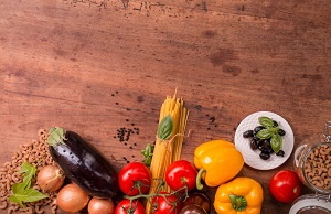 Fruits, veggies, grains, and other food spread out on a table.