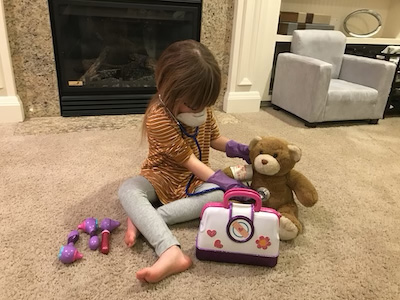 Sienna Balumas playing with her doctor kit