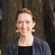 Cayley Eller smiling in front of a tree