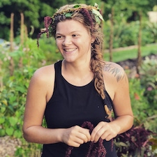 Alexandria Stone smiling in a garden