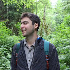 Joe Crumbley standing in the woods