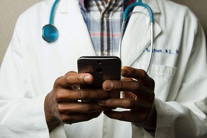 Health care provider viewing their smart phone