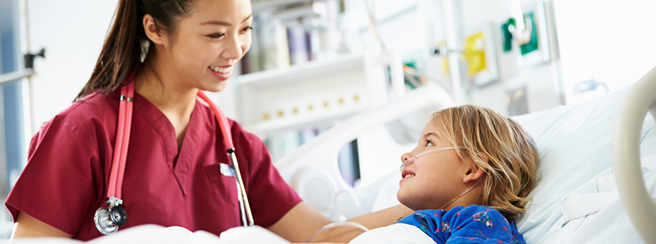 Stock photo of a health care provider interacting with a pediatric patient