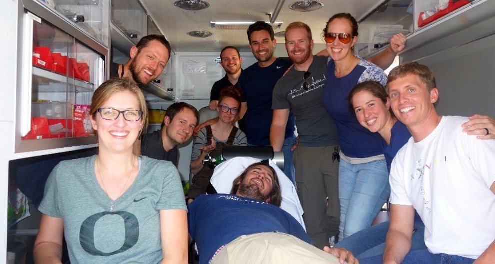 Group of residents in the back of an ambulance rig. 