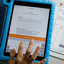 Photo of a tablet with an app to monitor a baby's progress in the Neonatal Intensive Care Unit.