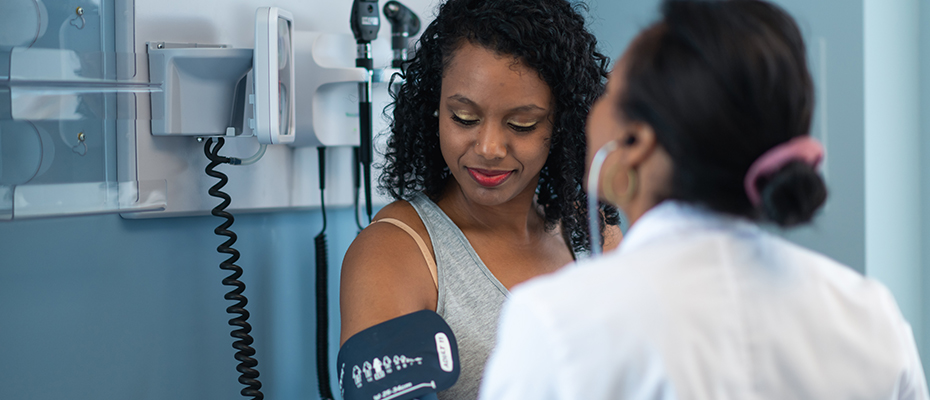 Nurse takes patient's blood pressure