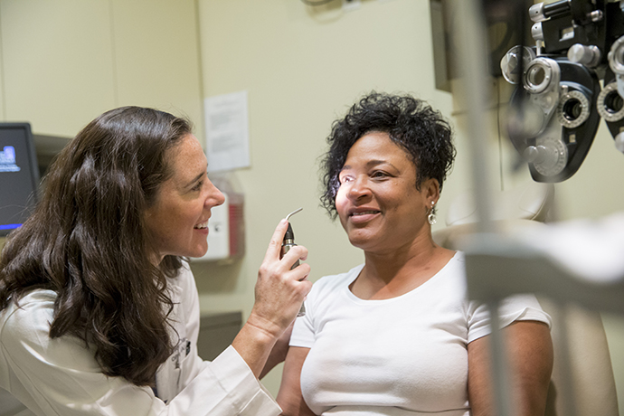Dr. Ellen Davis examines a patient in the Comprehensive Eye Clinic