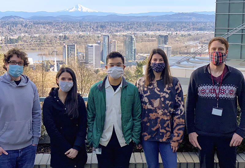Members of James Frank's lab gather for a group photo with masks