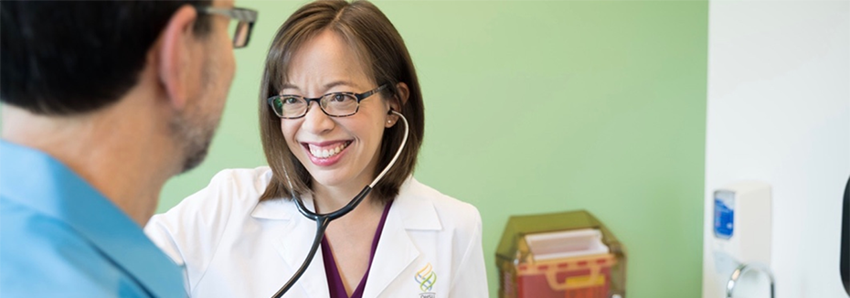 Hematologist-oncologist Rebecca Silbermann examines a patient