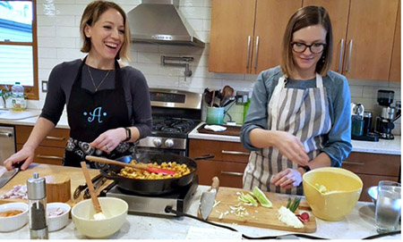 OHSU cancer dietitians Amanda Bryant (left) and Katherine Bagwell make tofu tacos in a cooking class