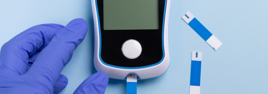 Stock photo of a blood sugar monitor with test strips