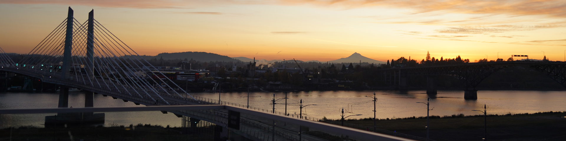 A view of the sunrise from the the Robertson Life Sciences Building at the South Waterfront, overlooking the WIllamette River and Mount Hood