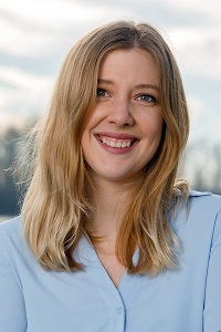 Allison Taylor smiling wearing a light blue shirt
