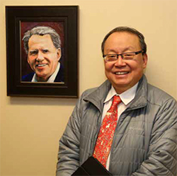 Dr. Yoo with Dean Richardson portrait