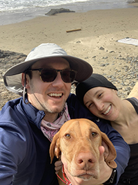 Will Wurster taking a selfie with his partner Lindsey and their dog Penny at the beach.