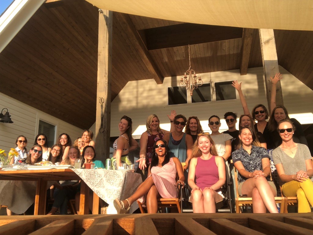 Diagnostic Radiology Women in Radiology Sept 2021 get together- group of women in a party setting sitting on a deck looking at the camera