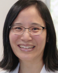 Headshot of Miranda Lim, wearing glasses