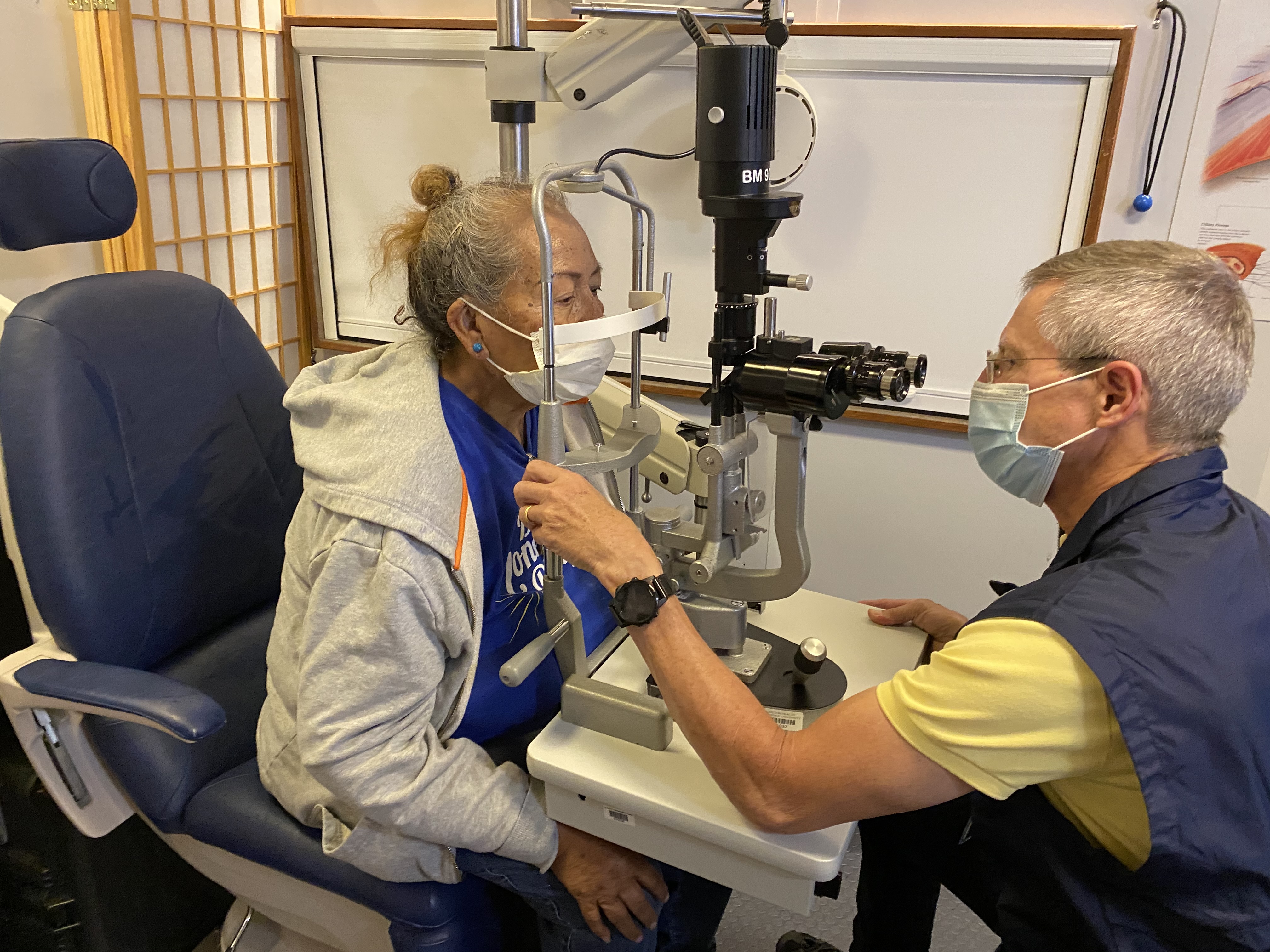 Casey Community Outreach Program volunteer Dr. Bentley provides a eye exam for a participants