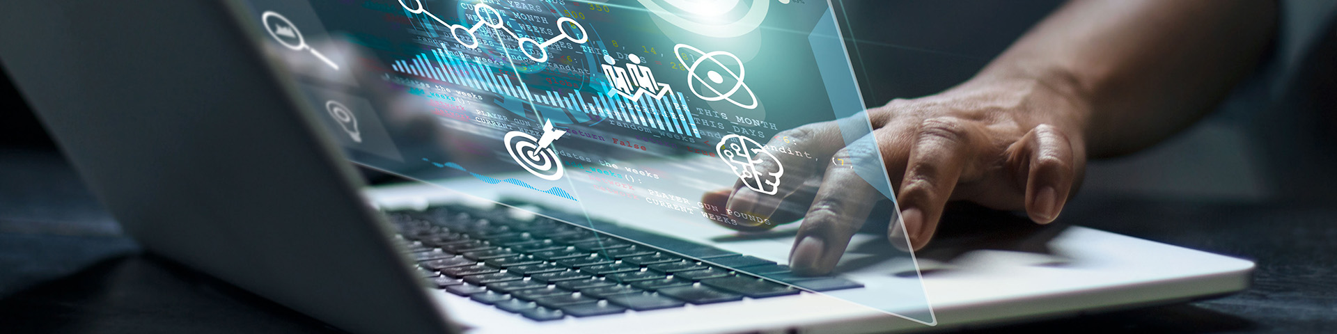 Hands on a laptop with abstract forms. Image courtesy of Getty Images