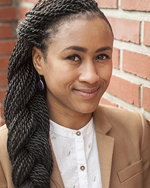 Sará King, Ph.D., posed outside in natural light, smiling