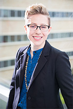 Outdoor photo of a smiling Doctor Holly Hinson