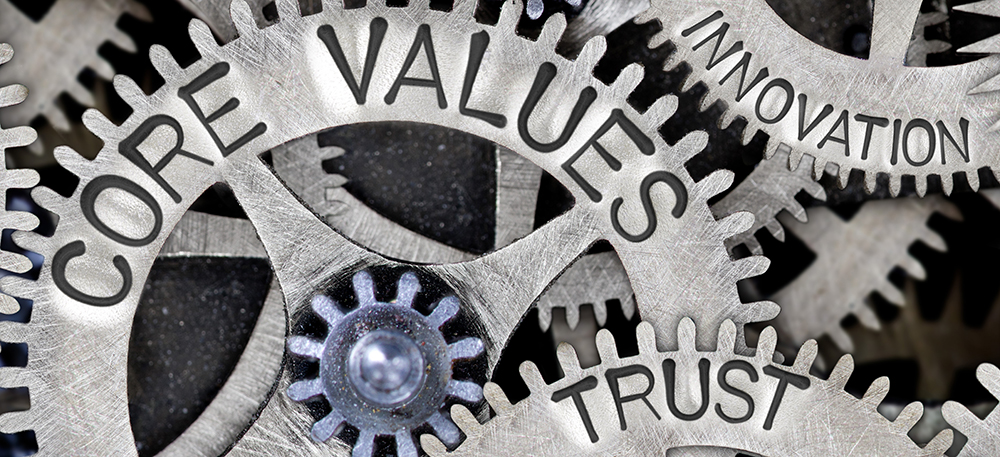 Image of gears labeled as core values, innovation and trust