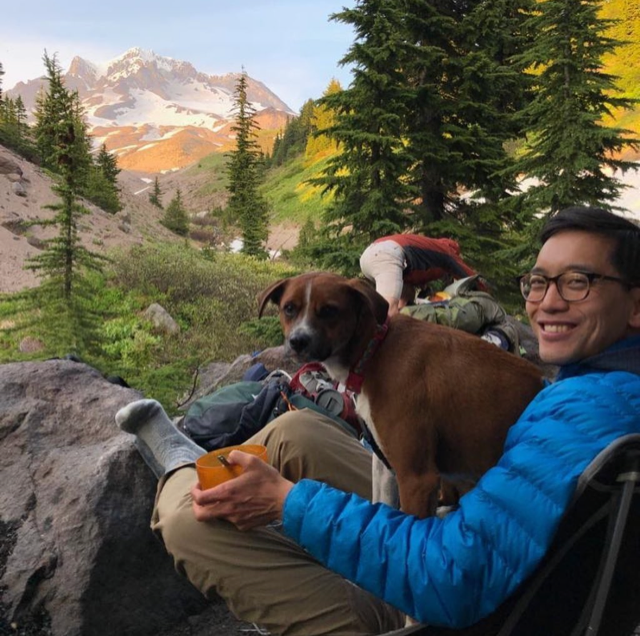 Dr. Anthony Cheng camping with his dog