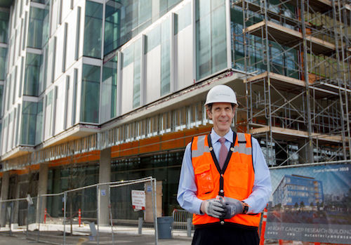Dr. Brian Druker standing in front of the KCRB during construction in 2018