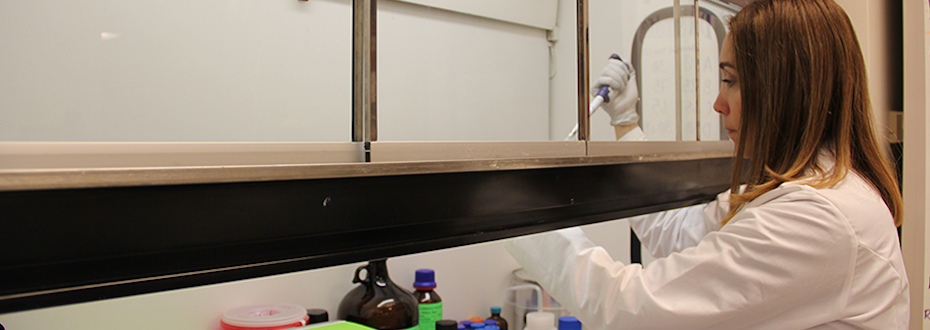 A researcher in a lab preparing samples