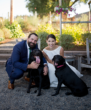 Photo of Dr. Elizabeth Lieberman, her husband and their dogs