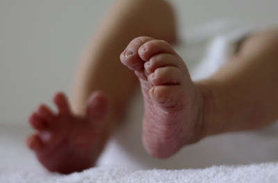 A baby's feet and legs