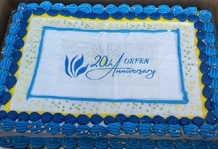 Blue, white, and yellow 20th Anniversary ORPRN cake
