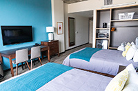 Our standard private bedrooms have two beds, desk, TV, mini fridge, toaster oven and coffee pot.