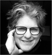 Black and white image of Lisa Schimmel wearing glasses