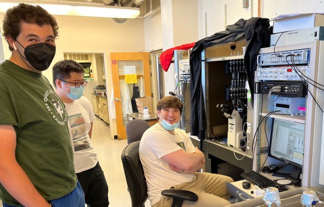 Researchers at an electrophysiology rig