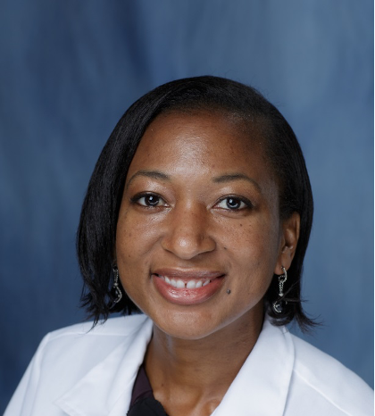 Dr. Alexis Simpkins smiles in a white coat in a full color photo