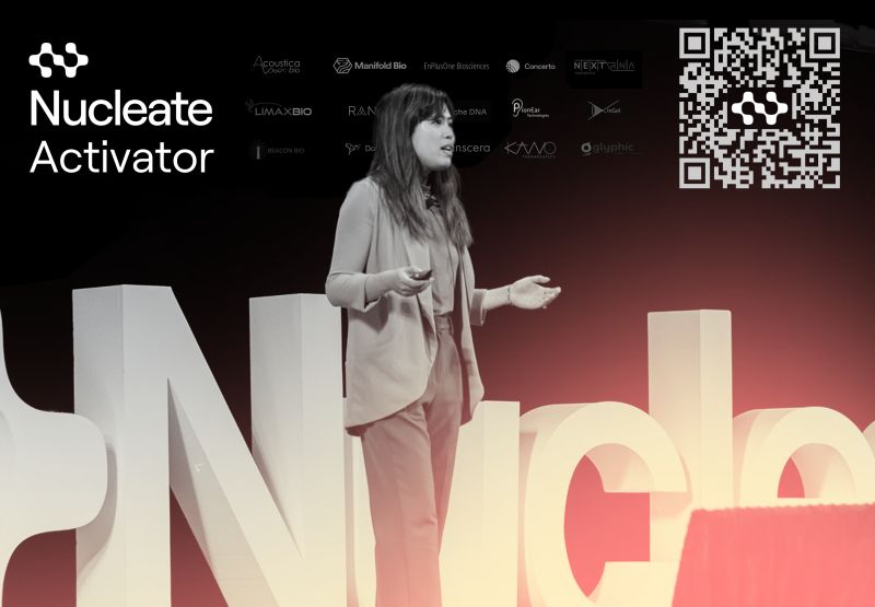 A woman speaking on a stage - Nucleate Activator