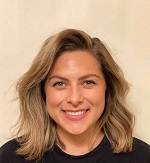Image of Jen Barrientos with blonde hair and wearing a black shirt