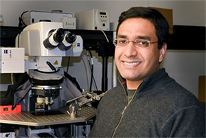Vivek Unni, seen smiling in his lab